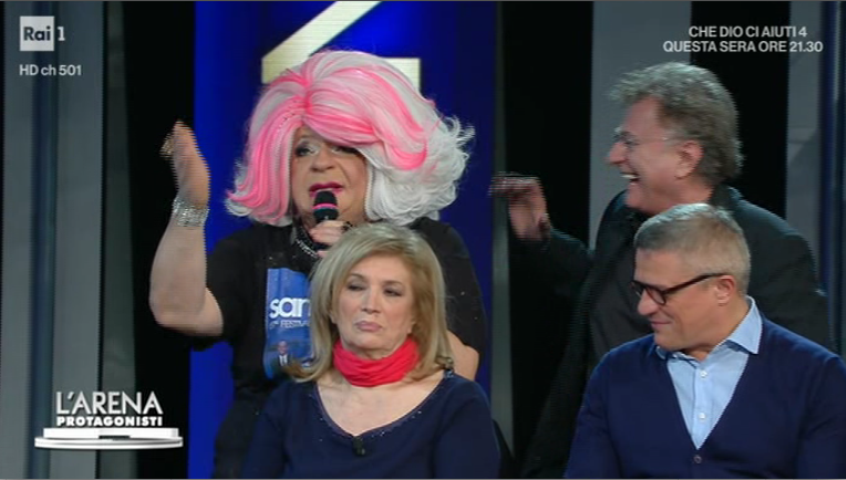 L’Arena, Malgioglio contro Sanremo. Poi il catfight con Platinette: “Sei isterica figlia mia”