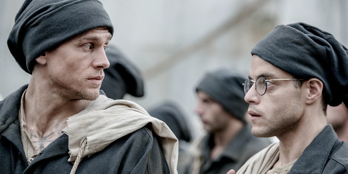 Papillon: trailer italiano e foto del remake con Charlie Hunnam e Rami Malek