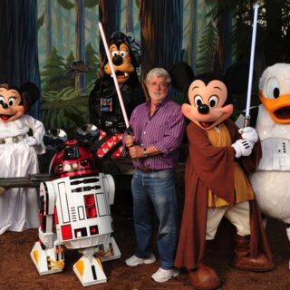 George Lucas Poses With A Group Of “Star Wars” Inspired Disney Characters At Disney’s Hollywood Studios
